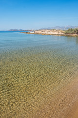 Sandy beach with amazing tranquil water on Paros island