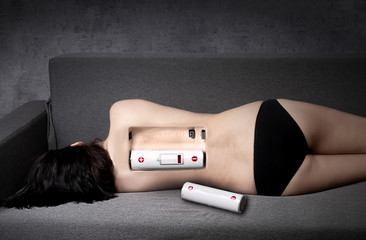 Tired woman on the bed. Low energy concept.