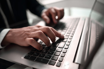 close up. businessman typing on laptop keyboard.