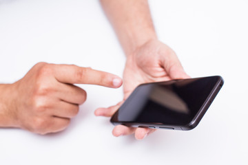 top view of hands holding a mobile phone