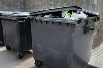 Black plastic trash containers for separate collection and sorting of garbage for environmental...