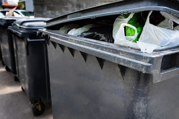Black plastic trash containers for separate collection and sorting of garbage for environmental protection