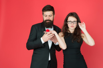 yes i do. valentines day. sexy couple in love. tuxedo man and elegant woman at engagement party. love date romance. formal couple. ring in box. woman make bearded man marriage proposal. copy space