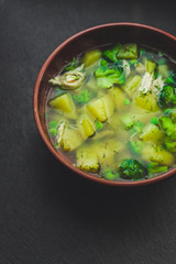 soup with broccoli, green peas and vegetables and other - concept. food background. top view