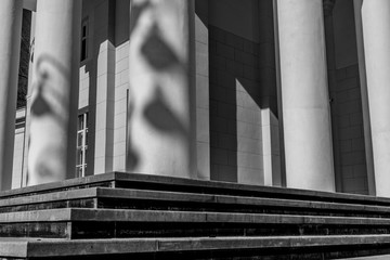 Shadows in the form of a ballerina on a column