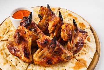 tasty grilled chicken wings with sauce