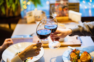Man and woman drinking red wine in the restaurant