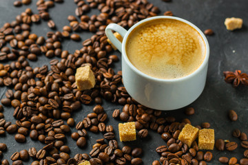 coffee fresh and hot in a white cup, aroma. serving of beverage (coffee grain). food. top view. copy space