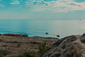The sea to the shore which swims up the ship.
