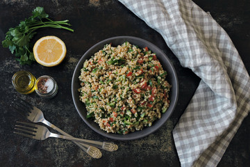 Middle Eastern salad with bulgur and vegetables. Tabbouleh salad.