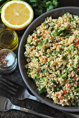 Middle Eastern salad with bulgur and vegetables. Tabbouleh salad.