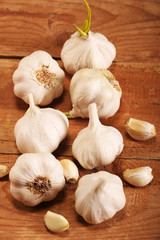 Garlic Cloves and Bulb on vintage wooden table. Top view.