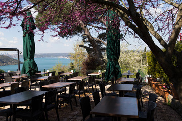 The people have a breakfast in the restaurant near the sea.the weather is beautiful in Beykoz.