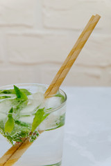 Close up image of lemonade with paper straws in it. Zero waste concept.