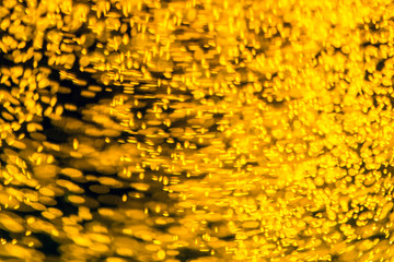 Refraction of drops of beer inside a glass