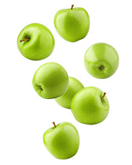 Falling green juicy apple isolated on white background, clipping path, full depth of field