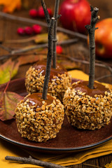 Caramel Apples on Wooden Background. Selective focus.