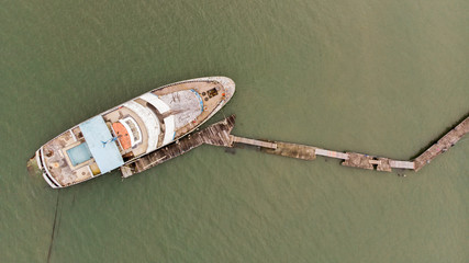 Drone view of an old yacht sunken.
