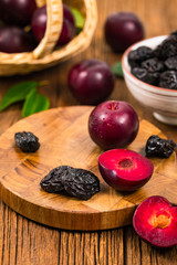 Dried Plums Pitted Prunes and Fresh Plums. Selective focus.