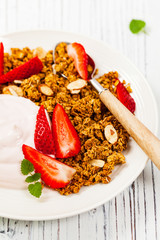 Strawberry Cinnamon Granola Yogurt Breakfast. Selective focus.