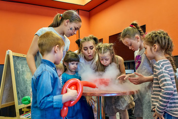 Chemical show for kids. Professor carried out chemical experiments with liquid nitrogen on Birthday...