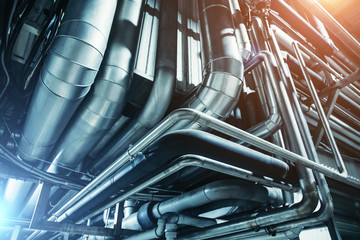 Industrial steel pipes or tubes of air ventilation system as abstract industry equipment background