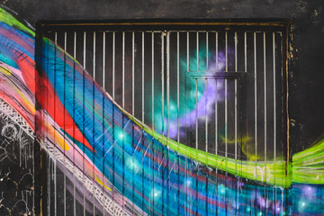 Detail of an anonymous street graffiti with many colors, cheerful urban background.
