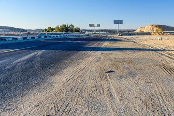 Asphalt road in arabian desert not far from the Hurghada city, Egypt