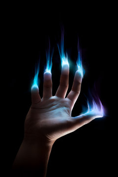 hand with supernatural powers on a dark background
