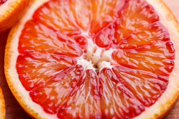 Blood orange cut in circles on a dark background