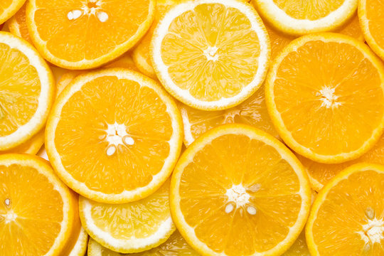 Background of sliced oranges and lemons in the shape of circles