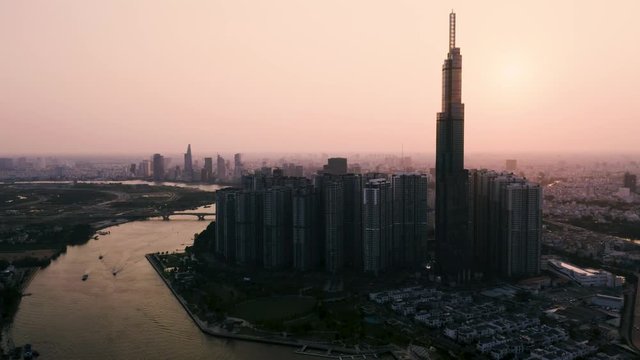 4k Aerial drone footage - Beautiful skyline of Saigon (Ho Chi Minh City) at sunset.  Vietnam, Asia