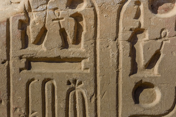 Egyptian ancient hieroglyphs on the stone wall
