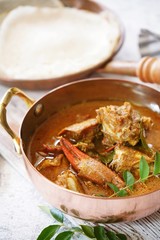 Kerala Spicy Crab curry served with Appam