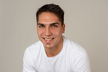 Fototapeta premium Portrait of attractive cheerful young man with smiling happy face. Human expressions and emotions