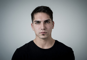 Portrait of a young mixed race man with angry face looking furious. Millennial angry man in his 20s