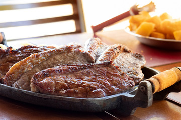 Grilled picanha, traditional Brazilian cut in a restaurant table