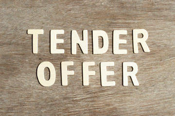 Alphabet letter in word tender offer on wood background
