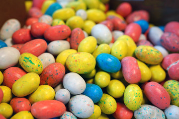 Small colorful chocolate eggs in hard sugar shell in bulk for Easter