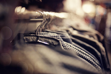 Clothes on hangers in shop