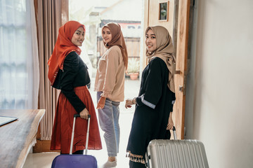 asian muslim friend or family with suitcase get ready for traveling - obrazy, fototapety, plakaty