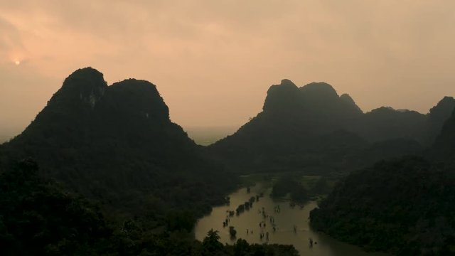 4k Aerial drone footage - Beautiful mountains and jungle of northern Vietnam at sunset.  Asia