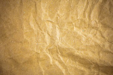 Vignette brown crumpled paper.