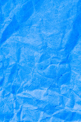 Blue vignette crumpled paper.