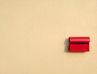 red mail box on wall