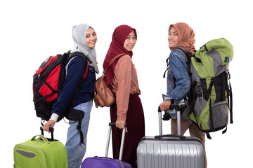 asian muslim woman eid mubarak travelling concept. friend with hijab and suitcase over white...