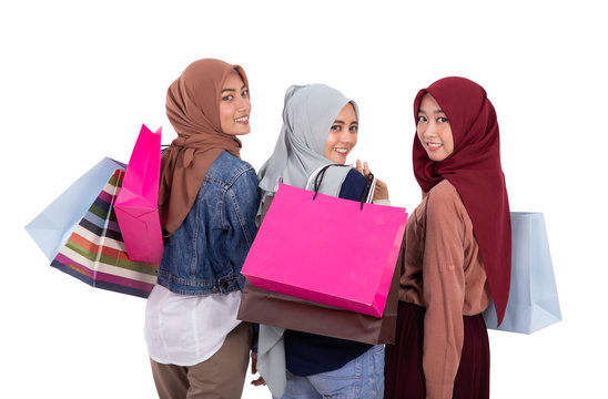 Asian Muslim Woman With Scarf Holding Shopping Bag Isolated Over White Background