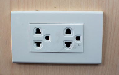 power plug socket On the wood wall For electricity in the home