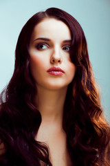 Fototapeta premium young pretty brunette woman with hairstyle waves, luxury look fashion makeup close up