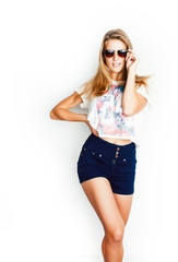 Fototapeta premium young pretty teen blond girl posing cheerful isolated on white background wearing sunglasses, lifestyle people concept